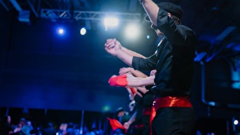 concert arena closeup of people on stage